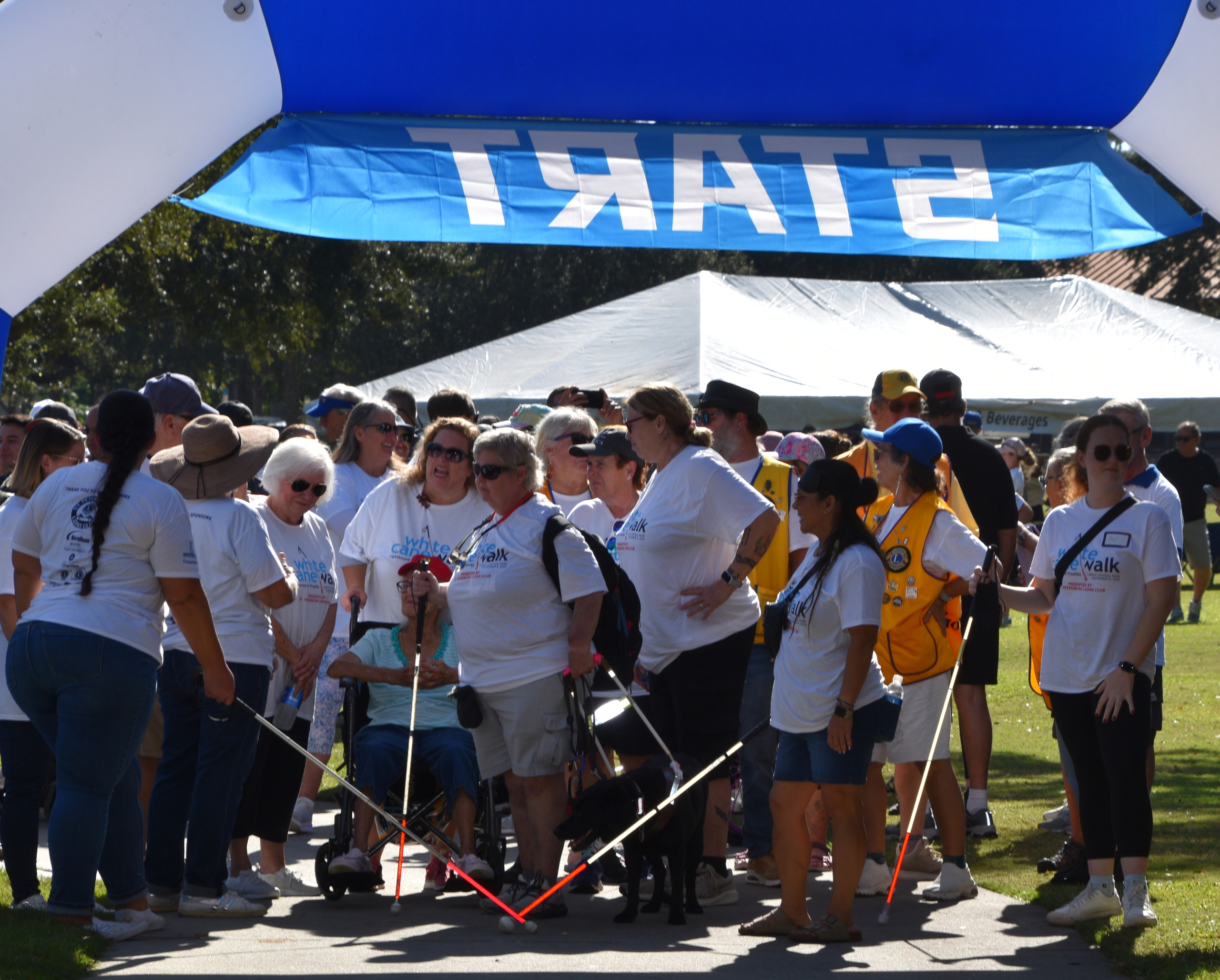 2025 Impact Report White Cane Walk participants at the Start sign.